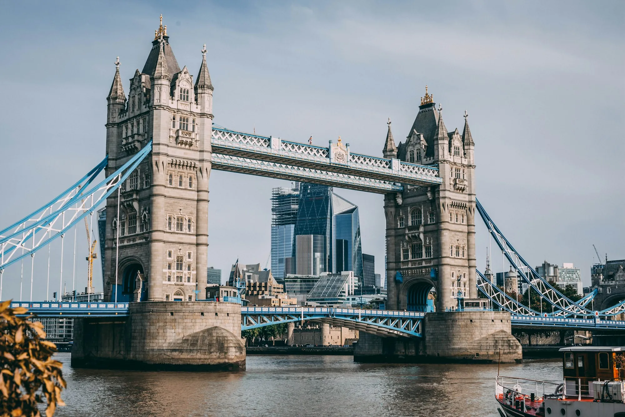 Tower Bridge over the Thames with the City of London skyline behind it