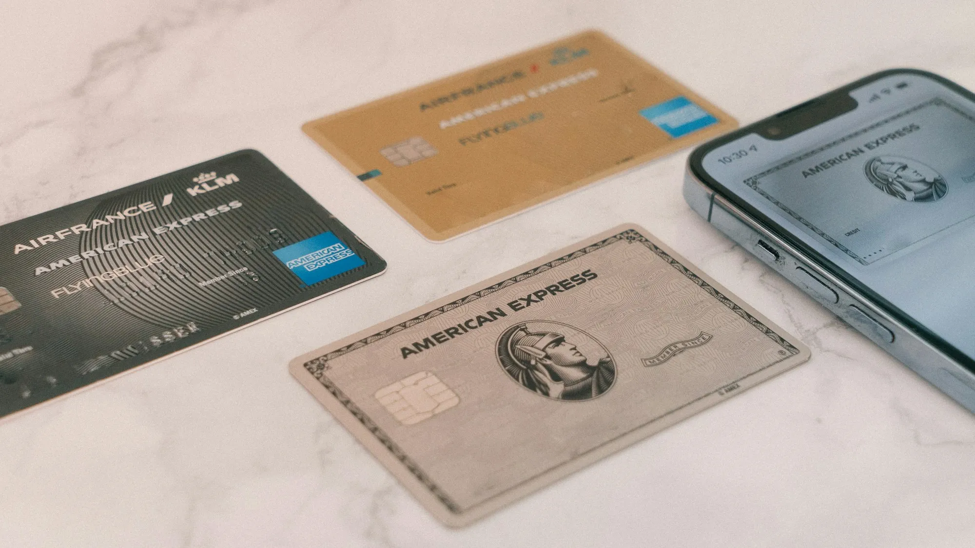 A close-up of a credit card resting on a boarding pass
