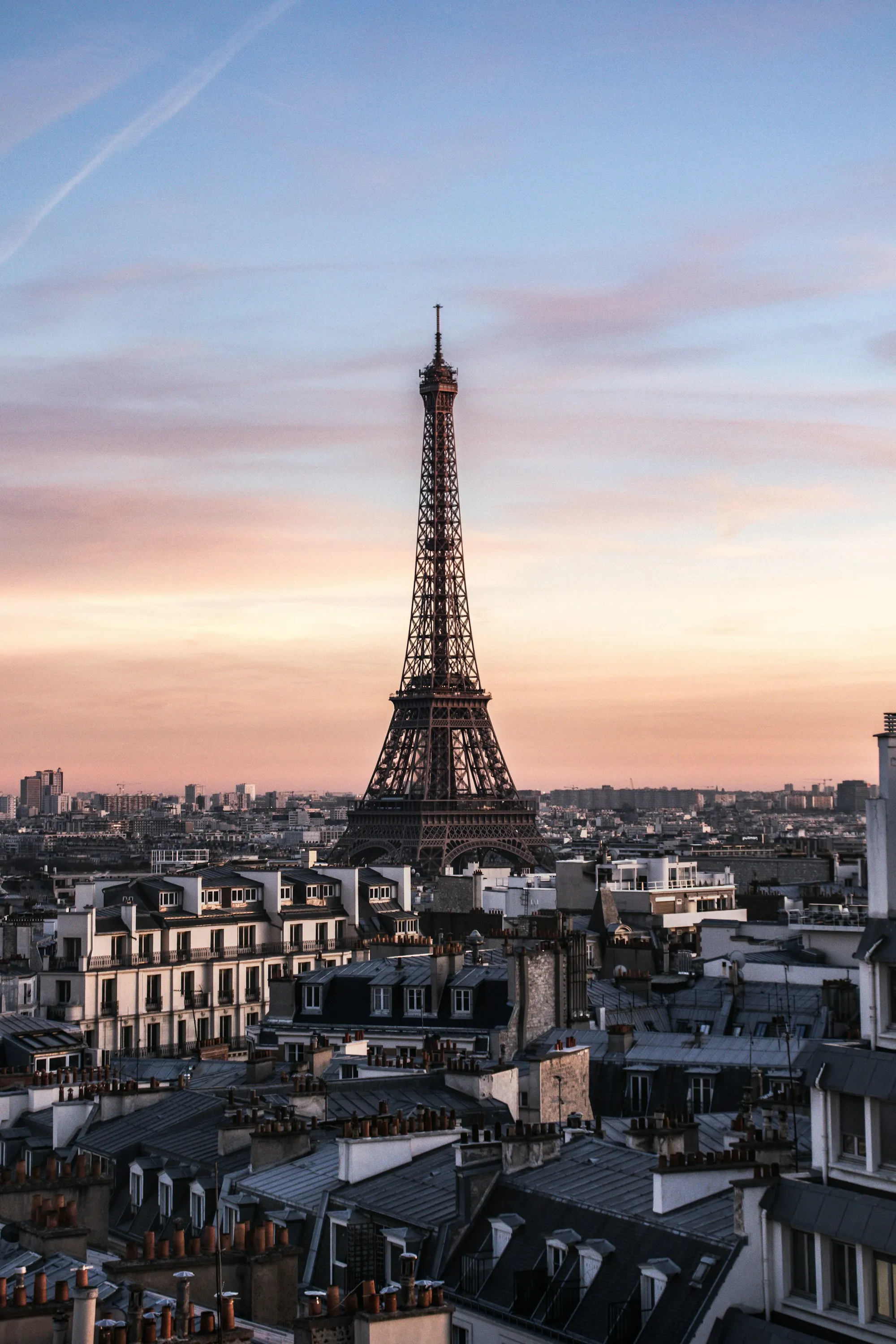 The Eiffel Tower rising above Paris rooftops